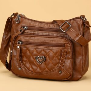 Sac à bandoulière tendance pour femme Un modèle uni et polyvalent, rehaussé d'un charmant détail en forme de cœur. Doté de multiples poches pratiques et d'une bandoulière facilement ajustable.