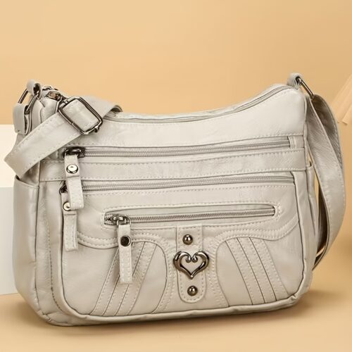 Sac Bandoulière Rétro pour Femme Laissez-vous séduire par ce nouveau sac à bandoulière au charme rétro irrésistible, pensé pour sublimer toutes vos tenues avec une touche d'élégance intemporelle.