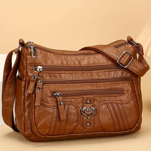 Sac Bandoulière Rétro pour Femme Laissez-vous séduire par ce nouveau sac à bandoulière au charme rétro irrésistible, pensé pour sublimer toutes vos tenues avec une touche d'élégance intemporelle.
