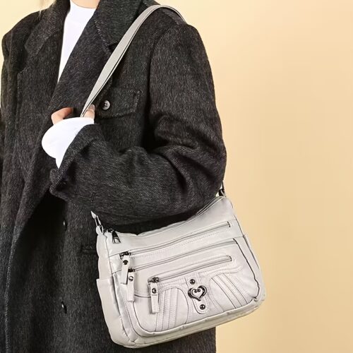 Sac Bandoulière Rétro pour Femme Laissez-vous séduire par ce nouveau sac à bandoulière au charme rétro irrésistible, pensé pour sublimer toutes vos tenues avec une touche d'élégance intemporelle.