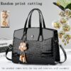 Sac à main pour femme à motif crocodile et liseré verni